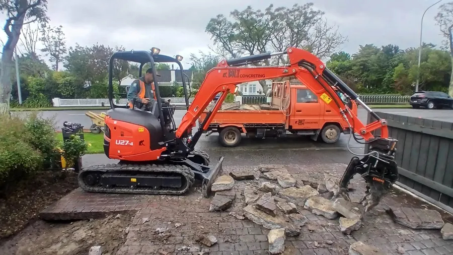 Bolt Concreting excavator and crew breaking out old paving in Palmerston North